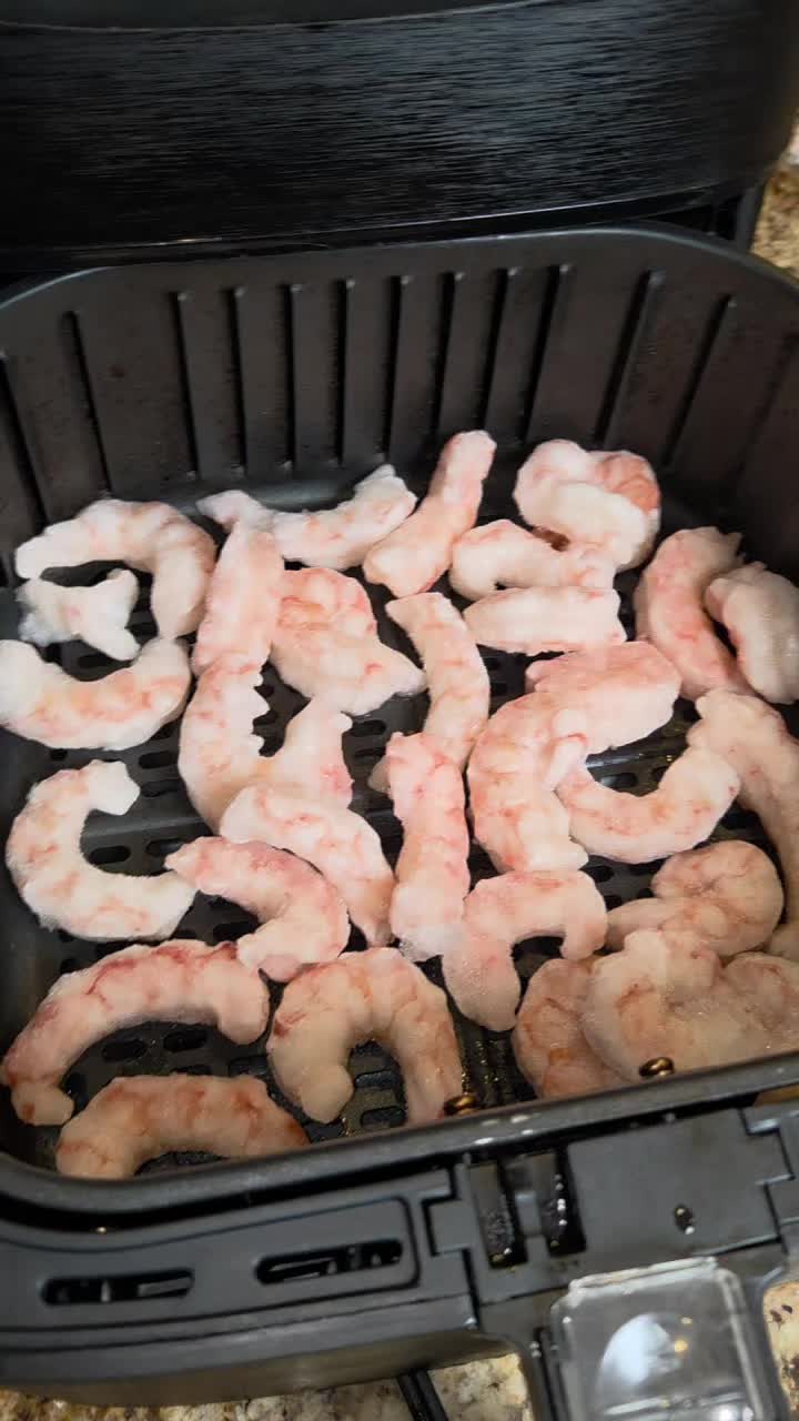 thank you @WeekdayPescatarian for your AMAZING recipe and method!! game changer!! here is her recipe: Air Fryer Frozen Shrimp with Garlic Butter Sauce 🍤 1 lb frozen large shrimp (no thawing needed) 4 tbsp salted butter 2 garlic cloves, grated 1 tsp Dijon mustard 1 tbsp fresh lemon juice Salt + pepper to taste Scallions + lemon wedges for serving Preheat air fryer to 375°. Add frozen shrimp in a single layer and air fry 6 minutes, until opaque. Add another 60–90 seconds if needed. While the shrimp cooks, microwave butter and garlic until melted. Stir in Dijon, lemon juice, salt, and pepper. I added crushed red pepper also Toss shrimp in the garlic butter sauce and serve with scallions and lemon wedges. So easy and so good 🤍 #airfryerrecipes #shrimprecipe #easydinner #seafoodlover 