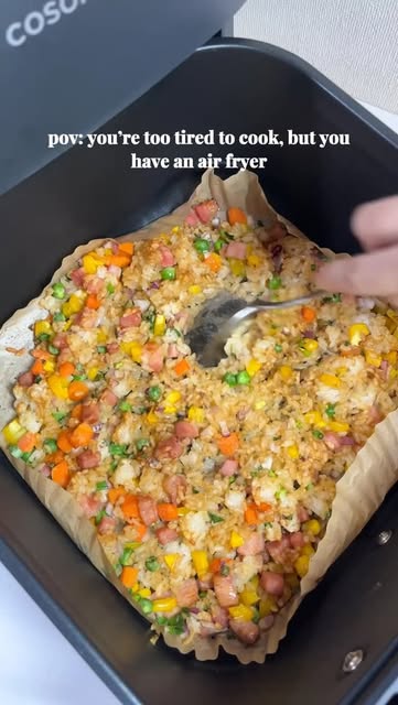 Air fryer fried rice… but make it EASY 🍳✨ 

2–3 servings, one basket, minimal effort 🤝 

Recipe: 
300–400g cooked rice (cold is best) 
Frozen mixed vegetables 
Red onion (chopped) 
Yellow paprika (chopped) 
Bacon (cut into small pieces) 
Spring onions 
1tsp of Chicken stock powder 
1tsp of Garlic powder 
2tsp of Soy sauce 
2eggs 

1. Add everything (except spring onions) into the air fryer basket. 

2. Season with chicken stock powder + garlic powder + soy sauce. 

3. Mix lightly so the rice breaks apart. 

4. Air fry at 180°C for 10 mins. 

5. Shake/stir halfway through for even cooking. 

6. Crack two eggs and air fry again at 180°C for about 5 minutes 
take it out and mix and put it back in the air fryer and cook for another 3-5 minutes 

7. Mix everything well 

8. Enjoy 😊 

#airfryerrecipes #easymeals #friedrice #lazycooking