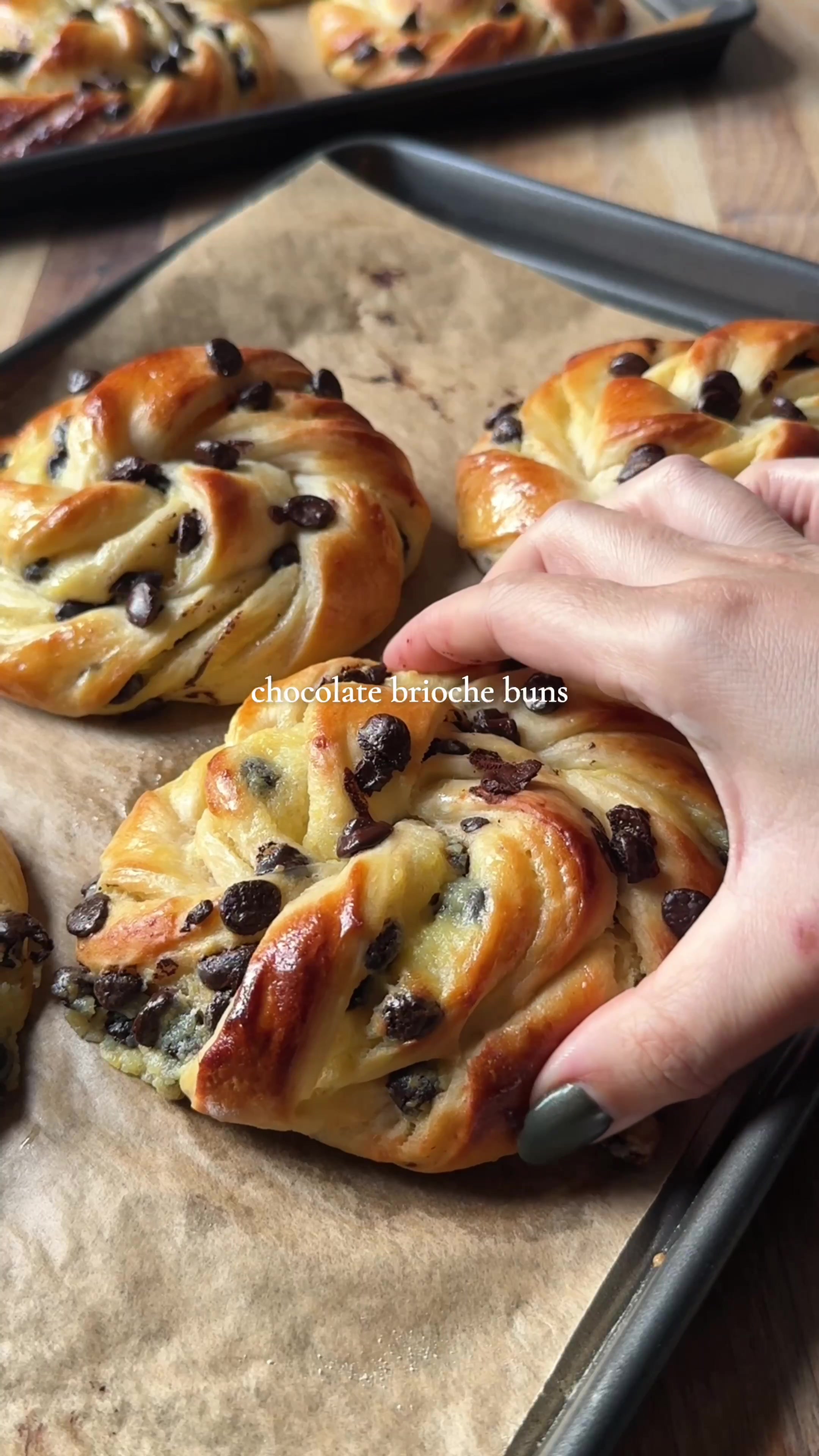 Chocolate and vanilla custard brioche buns 💕 For ALL of you asking - the app link for Osta is in my bio or you can search 'Osta Recipes' on the App Store or Google Play store ‼️🫶 Recipe for 8-10 buns:  - 250 ml whole milk (38 °C) - 50ml double cream (= heavy cream)  - 75g sugar - 40g active sourdough starter (optional - keep the same recipe if not using) - 7g instant yeast  - 3g salt - 165 g strong white bread flour - 385g T45 flour (or just more strong white)  - 70g unsalted butter, cubed and softened  - 130 dark chocolate chips  - 230-250ml thick vanilla custard (recipe in the comments) - Egg wash (1 egg whisked and sifted) In the bowl of your stand mixer, add warm milk, sugar, cream, starter and yeast first. Then add both flours and the salt. Mix on low for 3min and medium speed for 3min.  Go back to low speed and add the butter little by little. Continue kneading for 10-12min min more until smooth and the butter fully incorporated (method filmed and saved in my highlights).  Place the dough in a lightly oiled bowl, cover and let rise in a warm spot (25–28 °C) for 75-90min until almost doubled (longer if left at room temperature).  Roll the dough into a 60 × 40 cm rectangle (roughly).  Spread the custard evenly and then the chocolate chips.  Fold the dough twice (like a enveloppe) - put in the freezer for 5-10min (it will harden the dough and custard and shaping will be easier).  Slice into long strips (8-9 for large buns).  Twist each strip several times and shape into a roll. Place on baking trays lined with baking paper and let rise in a warm place for around 60min, until puffy.  Preheat your oven to 200c. Gently brush the buns with the egg wash.  Bake for 13-15min  until slightly golden. Optional: brush with some syrup (2tsp sugar mixed with 2tsp boiling water) for a glossy finish while still hot.  ##bakingfromscratch ##custard##chocolatechip##bakingrecipes#milkbun
