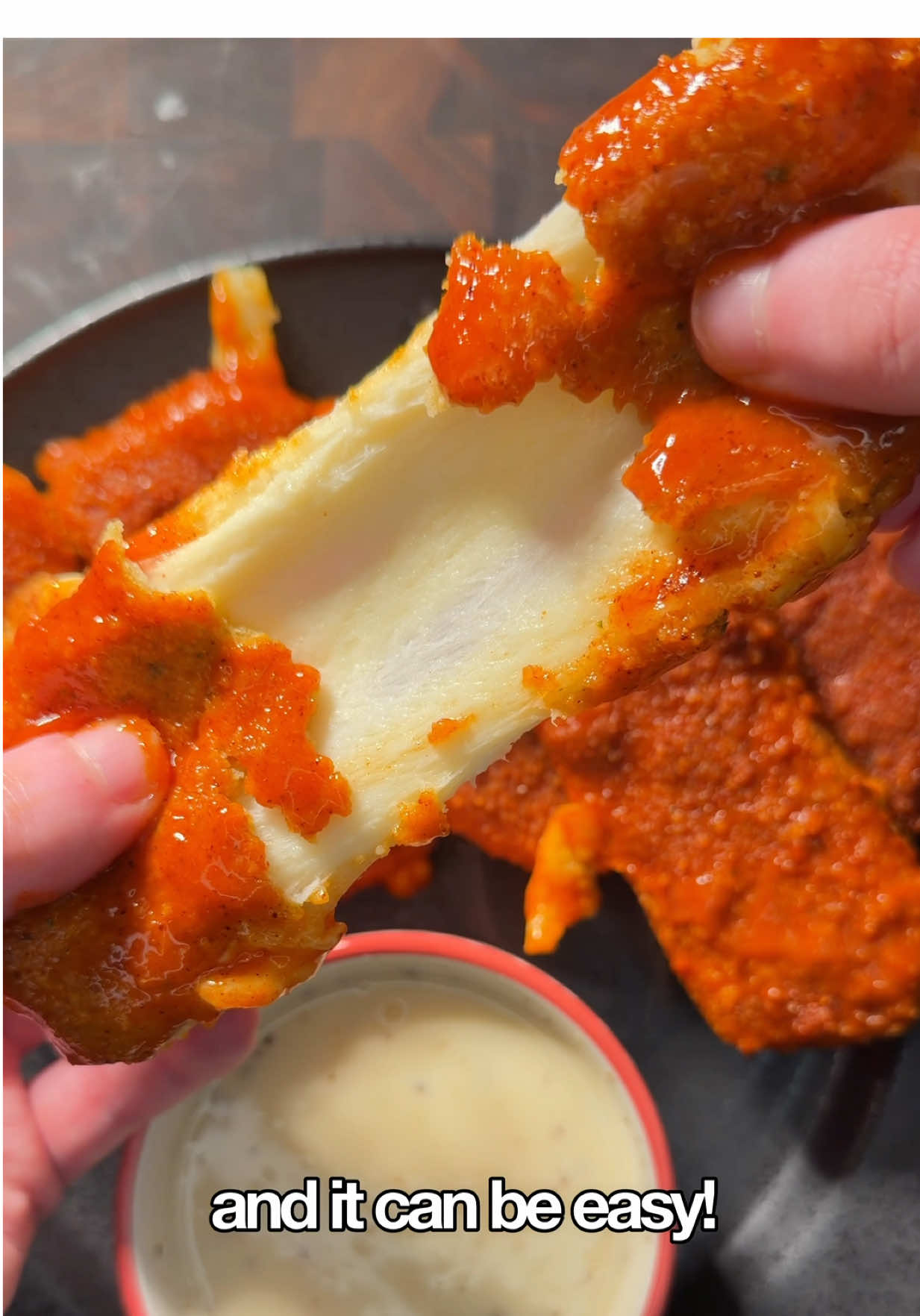 🧀 Air Fryer Nashville Hot Mozzarella Sticks 🧾 Ingredients For the mozzarella     •    1 lb block mozzarella     •    3 eggs     •    All-purpose flour     •    Breadcrumbs (any kind works) For my air fryer Nashville hot sauce     •    75 g hot sauce (about 5 tbsp)     •    4 tbsp olive oil     •    1 tsp cayenne     •    1 tsp garlic powder     •    1 tsp salt     •    1 tsp chili powder     •    3 tsp brown sugar 👨‍🍳 Directions (you can half recipe if 1 pound of cheese!!) 1️⃣ Cut the cheese I cut my mozzarella into about ½-inch sticks or squares. That size holds up really well in the air fryer. 2️⃣ Set up one breading station You’ll need flour, beaten eggs, and breadcrumbs. I like to add a few dashes of Tabasco to the egg wash for extra flavor. Coat in this order: Flour → Egg → Breadcrumbs → Egg → Breadcrumbs This double coating is key, it seals everything so the cheese doesn’t ooze out while cooking. 3️⃣ Freeze Pop them in the freezer for 30–60 minutes so they stay nice and sturdy. 4️⃣ Air fry Preheat to 375°F, lightly spray with oil, then cook for 10–14 minutes (depends how crispy you like them) until golden. 5️⃣ Make the sauce Whisk everything together, then microwave for about 15 seconds to bloom the seasonings. 6️⃣ Sauce & enjoy Brush the sauce over the sticks while they’re hot and dig in right away, that’s when the cheese pull is perfect. FUN FACT: The cheese pull reason (food science) Mozzarella stretches because it’s made using a process called pasta filata, where the cheese is heated and stretched, that’s what gives it that iconic stringy melt #mozzarellasticks #easyrecipe #recipes #homecook 
