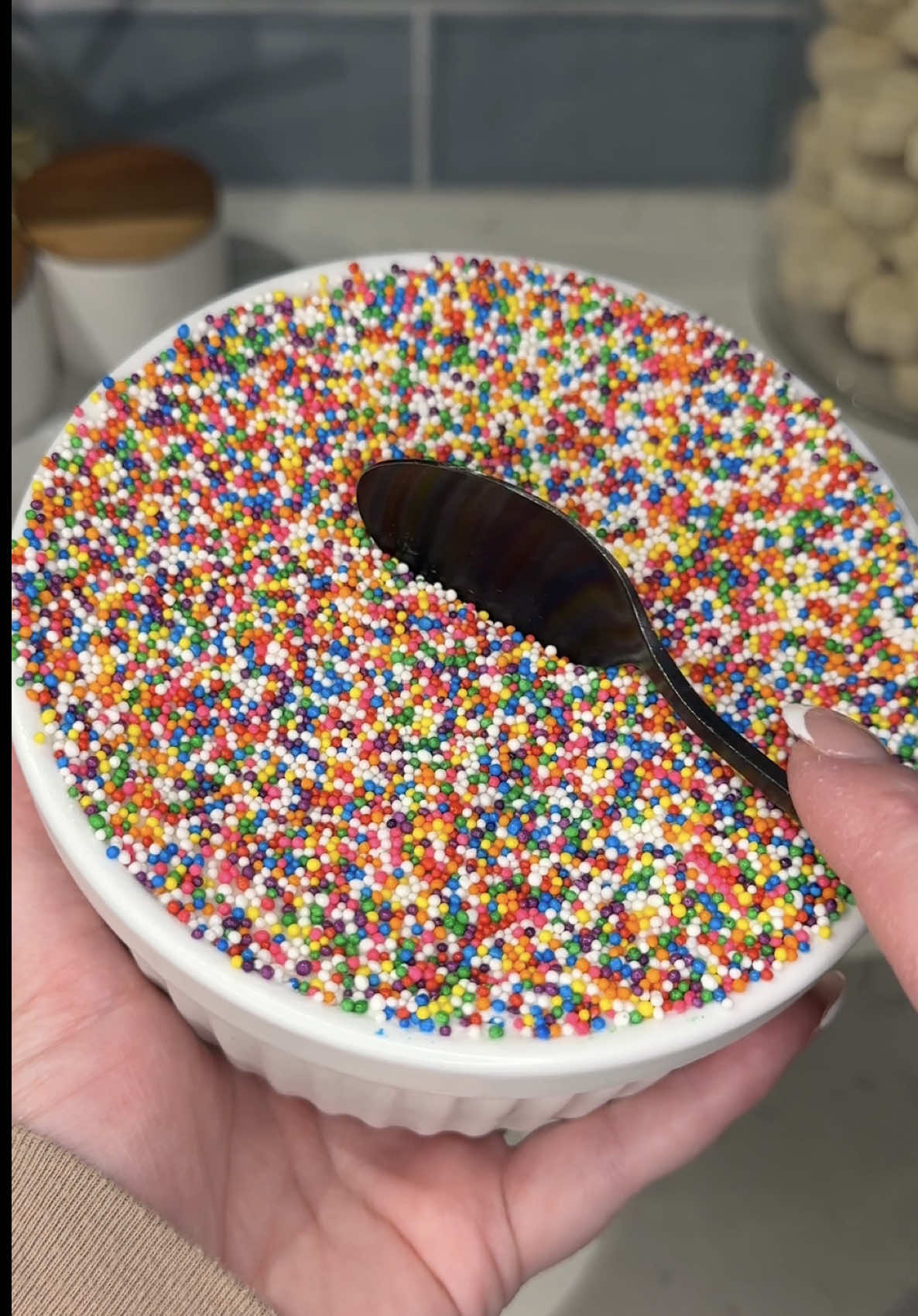 so we can officially make the viral dot cake at home and it’s my new favorite little treat 🧁🌈 Ingredients: 1 box @Funfetti cake mix 3 eggs 1 cup water 1/2 cup oil funfetti vanilla frosting rainbow nonpareils sprinkles Instructions: In a large mixing bowl, mix cake mix, eggs, water, and oil until well combined and transfer to a greased square baking pan. Bake at 350° for 35-40 minutes, covering with foil halfway through. Allow to cool completely, then press greased ramekin into the center and twist to remove. Allow mini cake to slide out of ramekin and slice through the center to create 2 layers. Place bottom layer back in ramekin, top with a layer of frosting, then place top layer of cake with another layer of frosting spread evenly to the edges. Cover in rainbow nonpareils, allow to chill and slightly harden in the fridge, then take a center bite and enjoy! 😋 #cake #recipe #baking #dessert #creatorsearchinsights 