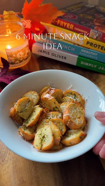 6 minute snack in your airfryer with your left over bagels! Delicious, quick and easy! Full recipe below ⬇️ 
Ingredients: 
-1 plain bagel
-3 tsp butter 
-1 tsp garlic 
-1 tsp parsley 
-Parmesan cheese 
Method: 
Cut your bagel up in to small circles and place to one side
-in a bowl, add melted butter; garlic powder and parsley and mix well
-pour this over your bagels making sure there all covered 
-place them in the air fryer for 6 minutes on 200 degrees Celsius, top with some Parmesan cheese and enjoy! #snack #easyrecipe #airfryerrecipes #snackingtime #quickrecipes