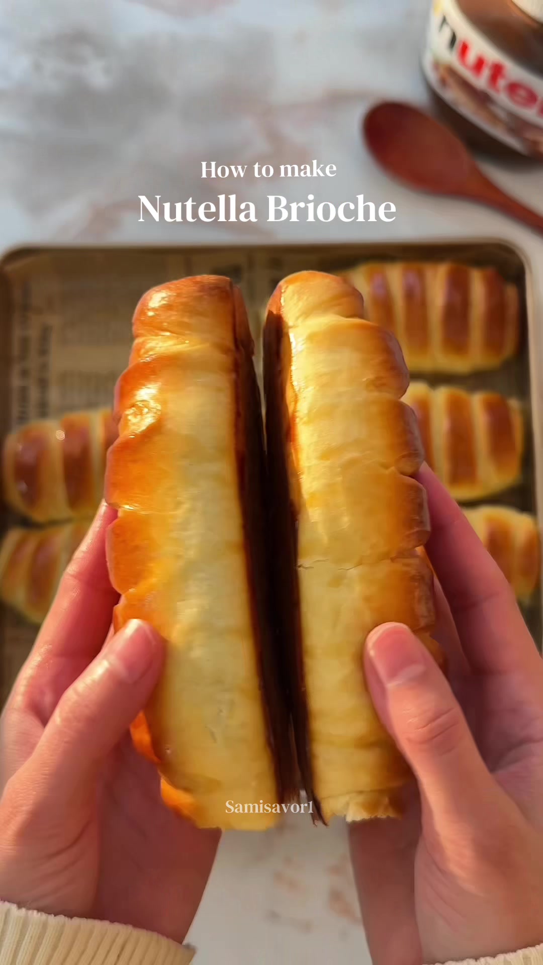 Easy Nutella Brioche Rolls 🍫🥖 Soft, pillowy brioche rolls filled with creamy Nutella, perfect for a homemade bakery treat! 📖 Ingredients 200 ml warm milk 60 g sugar 1 tsp vanilla extract (optional) 7 g instant yeast 2 large egg 500 g all-purpose flour (plus extra if needed) A pinch of salt 100 g unsalted butter, softened Nutella for filling 👩🏻‍🍳 Method 1. Combine the warm milk, sugar, and yeast in a mixing bowl. Give it a quick stir and let it stand for a few minutes until slightly foamy, then beat in the eggs and add the vanilla extract. 2. Add the flour and salt to the mixture and stir until everything comes together into a shaggy dough. 3. Start kneading the dough, gradually incorporating the softened butter in small portions. Continue kneading until the dough becomes smooth, stretchy, and elastic. 4. Transfer the dough to a lightly oiled bowl, cover it, and leave it in a warm spot until it doubles in size (about 1 hour). A warm, steamy oven can help speed this up. 5. Once risen, gently deflate the dough and portion it into 12 equal pieces. Shape each piece into a round. 6. Flatten each ball into an oval or rectangle. Spread a layer of Nutella over the surface, leaving a small border. 7. Fold the dough over the filling, then cut slits along one side and twist or wrap them over to form a braided effect. 8. Arrange the shaped rolls on a lined baking tray. Cover loosely and let them rise again until they look soft and puffy, about 30–45 minutes. 9. Brush the tops with egg wash and bake in a preheated oven at 180°C / 350°F until golden and cooked through, roughly 18–20 minutes. 10. While still warm, lightly brush with melted butter before serving.  #nutellarecipe #brioche #easyrecipes #briocheroll 